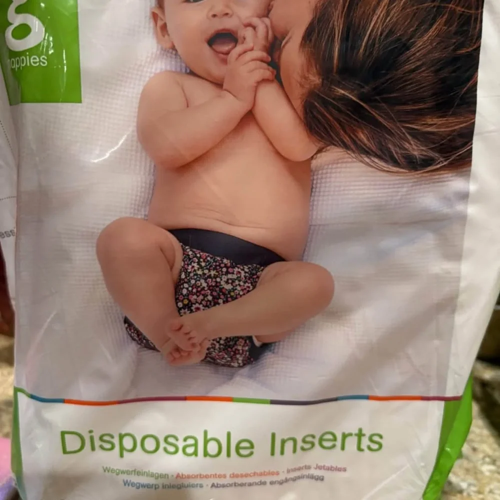 Disposable inserts, cloth inserts and diaper washing system